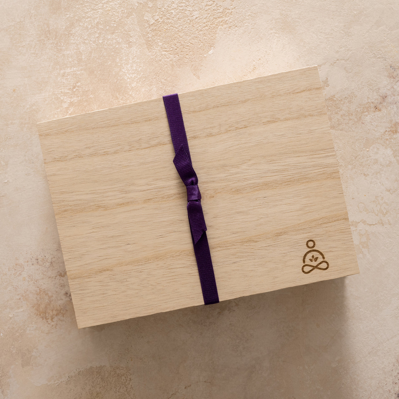 Green Goo's Sierra Sage Sleep Secrets Gift Set comes packaged in an embossed wooden collector's box, wrapped in purple ribbon.