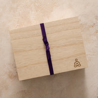 Thumbnail for Green Goo's Sierra Sage Sleep Secrets Gift Set comes packaged in an embossed wooden collector's box, wrapped in purple ribbon.